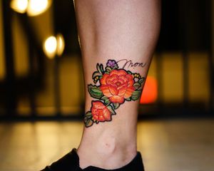 Embroidery flower tattoo on leg
