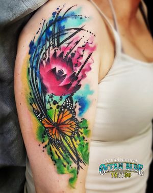 lotus and butterfly watercolor tattoo by Daniel Natural