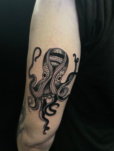 Get a unique and detailed octopus tattoo with stunning illustrative style by the talented artist Jess.