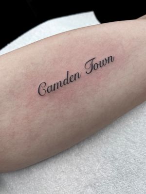 Elegantly designed small lettering tattoo by Claudia Whiteheart on arm. Perfect for minimalist tattoo lovers.