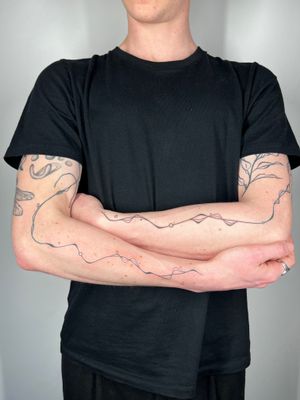 Unique hand-poked design by Dan Bramfitt featuring freehand abstract lines and wavy motifs.