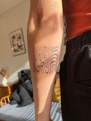 Get a unique and intricate hand poke tattoo featuring abstract wavy designs by the talented artist Dan Bramfitt, also known as Danyul.