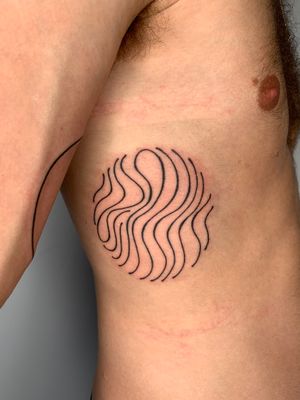 Get inked with a unique hand-poked tattoo by Dan Bramfitt, featuring a wavy and abstract design. Stand out from the crowd with this personalized body art.
