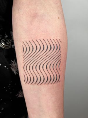 Discover the unique illustrative style of Dan Bramfitt with this mesmerizing tattoo design featuring intricate wavy lines and abstract patterns.