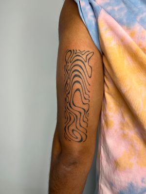Get a unique and artistic hand-poked tattoo by Dan Bramfitt, featuring abstract and freehand motifs for a one-of-a-kind design.