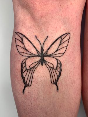Unique butterfly tattoo by Dan Bramfitt, aka Danyul, in a bold ignorant style on the lower leg.