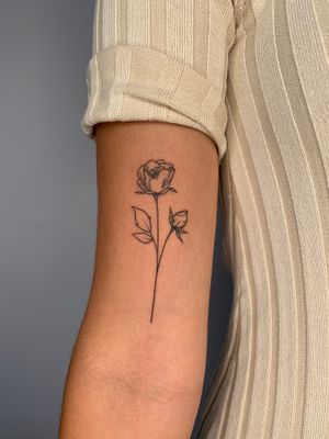 Get inked with a bold and beautiful rose design by the talented artist Dan Bramfitt, also known as Danyul. Perfect for your arm!