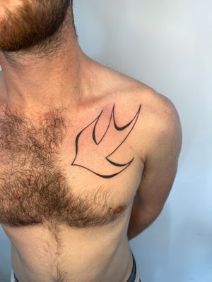 Unique hand poked tattoo of an abstract dove design by Dan Bramfitt, also known as Danyul.