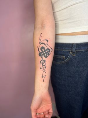 Embrace the beauty of blackwork with this abstract flower tattoo by renowned artist Danyul.