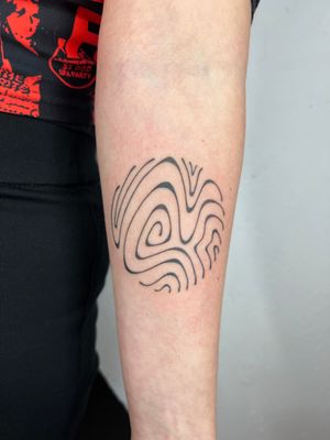 Unique hand-poked tattoo design featuring abstract wavy tile motif by artist Dan Bramfitt.