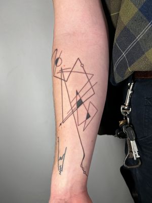 Get inked with a unique abstract geometric design by the talented artist Danyul. Stand out with this modern and stunning tattoo.