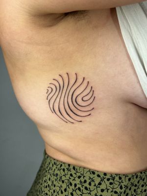 Get mesmerized by wavy abstract lines hand-poked by Dan Bramfitt, also known as Danyul. Unique and dynamic tattoo design.