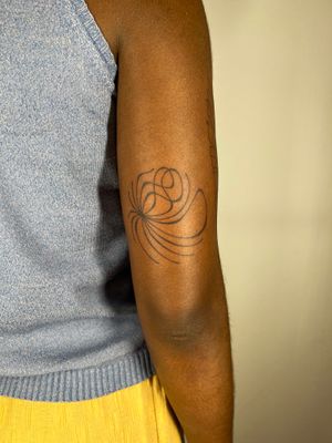 Explore the unique style of hand-poke tattooing with this abstract design on dark skin by artist Dan Bramfitt, also known as Danyul.