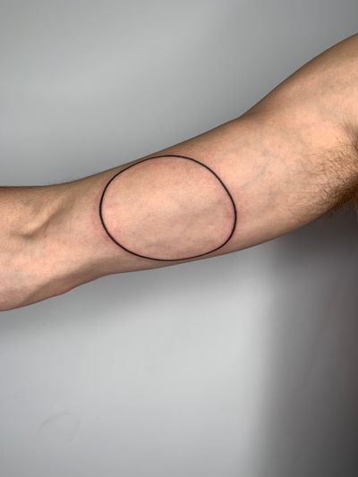 Get a unique circle tattoo by Dan Bramfitt, known as Danyul, with intricate fine line detailing and hand-poke technique.