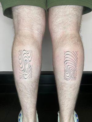 Elegant and intricate fine line tattoo by Dan Bramfitt featuring flowing and wavy abstract lines.