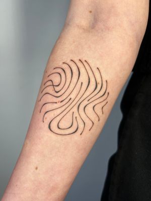 Experience the unique artistry of Dan Bramfitt with this hand-poked abstract design on dark skin.