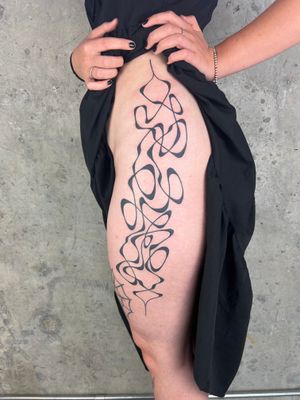Get a unique freehand blackwork tattoo by Dan Bramfitt with abstract lines design. Express your individuality with this striking tattoo.