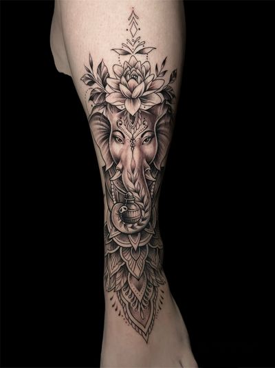 Avi's striking black and gray tattoo features a majestic elephant adorned with intricate mandala and ganesha designs.