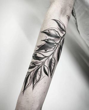 Unique blackwork tattoo featuring an illustrative branch sketch by talented artist Helena Velazquez.
