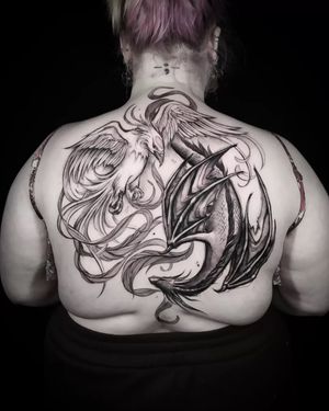 Helena Velazquez beautifully combines these mythical creatures in an illustrative black and gray tattoo. Symbolizing harmony and renewal, this tattoo makes a stunning statement.