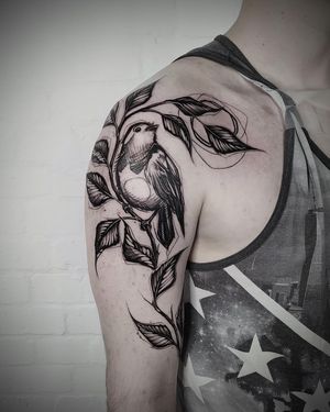 Get a stunning blackwork bird tattoo sketched by Helena Velazquez, featuring a delicate branch motif. Perfect for a unique and artistic look.