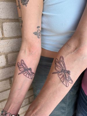 Get a mesmerizing dragonfly tattoo in a single line style by Well Good Mate. Perfect for those who love minimalist designs.