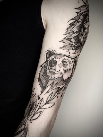 Get a powerful blackwork tattoo featuring a bear and lion in a sketch style by tattoo artist Helena Velazquez.
