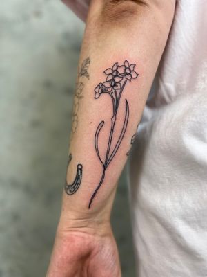 Elegant fine line tattoo of a beautiful flower done by Well Good Mate, perfect for a subtle and chic look.