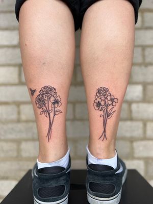 Get a delicate and elegant fine line flower tattoo done by the talented artist Well Good Mate.