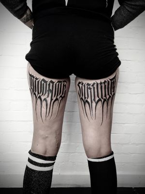 Elegantly crafted lettering tattoo on the thigh by Helena Velazquez, showcasing artistic flair and precision.