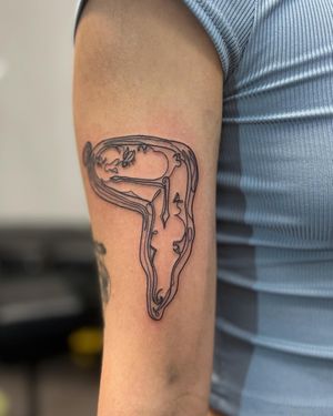 Experience the dream-like world of Salvador Dali with this fine line tattoo featuring a melting clock in a single line design. Surrealism at its best by Well Good Mate.