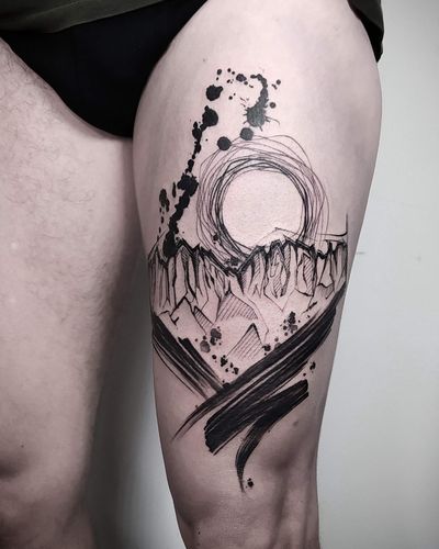 A stunning blackwork tattoo featuring a watercolor mountain sketch, expertly done by the talented artist Helena Velazquez.