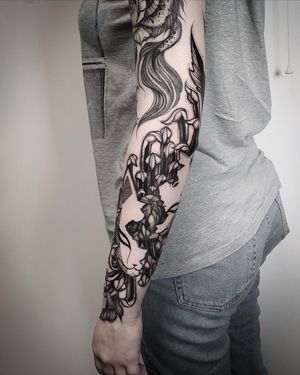 Explore the mystique of the kitsune in this intricate blackwork tattoo, expertly crafted by Helena Velazquez.