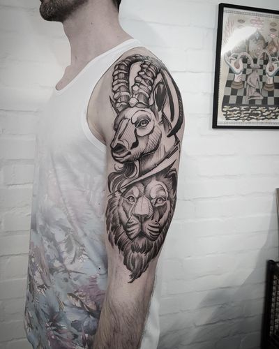 Get inked with this blackwork illustrative tattoo featuring a goat, lion, and ibex by the talented artist Helena Velazquez.