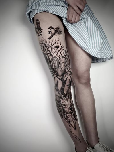 Elegant blackwork tattoo featuring a moon, deer, bird, tree, squirrel in sketch style by Helena Velazquez.
