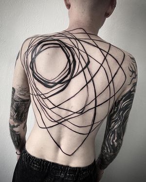Helena Velazquez creates a stunning blackwork pattern tattoo on the back, showcasing her skill and precision.
