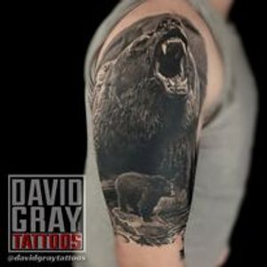 Realistic bear tattoo with cub in river