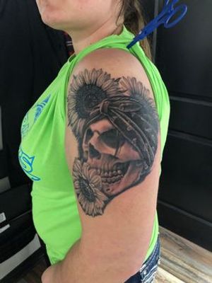 Skull wearing a bandanna with sunflowers tattoo