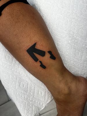 Get a stylish blackwork tattoo of Michael Jackson by the talented artist Miss Vampira. Simple yet iconic.