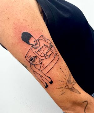 Get spooky with this blackwork beetlejuice tattoo by Miss Vampira. Minimalistic yet iconic design.