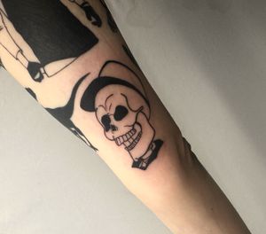 A fierce blackwork skull design, expertly executed by the talented artist, Miss Vampira. Perfect for those with a bold and edgy style.