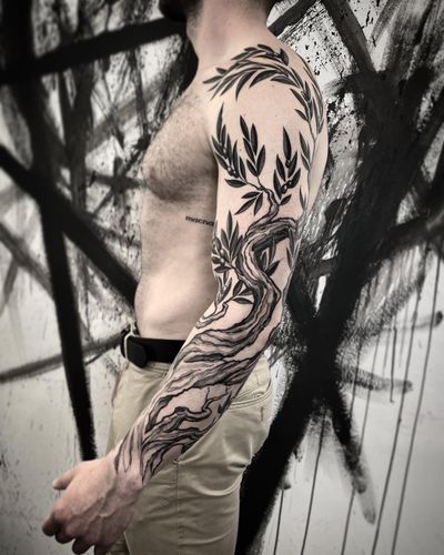 Get a stunning blackwork illustrative tattoo of a tree branch by talented artist Helena Velazquez.