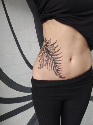 Get a stunning illustrative tattoo of a fern and acorn by the talented artist Helena Velazquez.