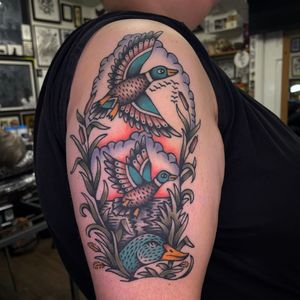 Get a beautifully crafted traditional duck tattoo on your shoulder from the talented artist Sam Young. Perfect for nature lovers!