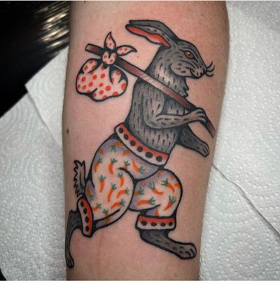 Get a classic traditional rabbit tattoo on your lower leg by the talented artist Sam Young. Book your appointment now!