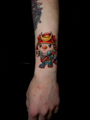 Adorable anime-style tattoo featuring a kawaii version of Chopper, created by the talented artist Frankie Brown.