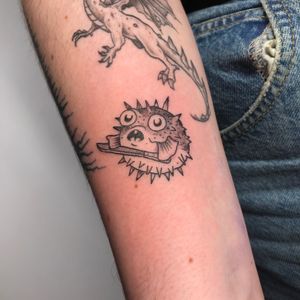 Get a unique and bold illustrative puffer fish tattoo by the talented artist Jonathan Glick. Stand out with this edgy design!