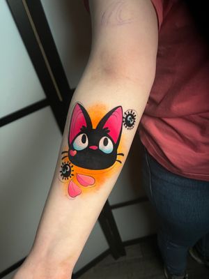 Capture the magic of Studio Ghibli with this illustrative watercolor tattoo featuring Jiji, the iconic black cat. Let Cloto.tattoos bring your favorite character to life on your skin!