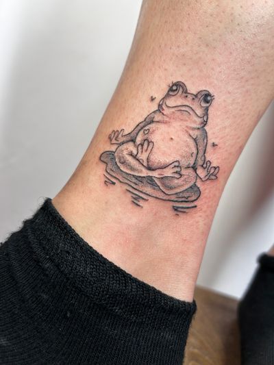 Unique frog tattoo by Jonathan Glick with bold illustrative style, perfect for those who love bold and eye-catching designs.