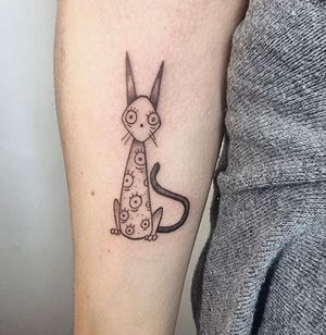 Ignite your inner wild with this illustrative cat tattoo by Jonathan Glick. Bold, unique, and full of attitude.